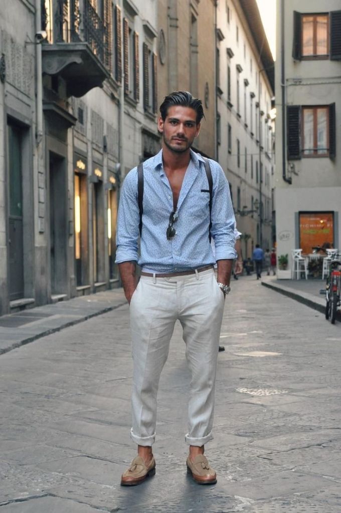 Italian man wearing a button down, white jeans, loafers, and sunglasses